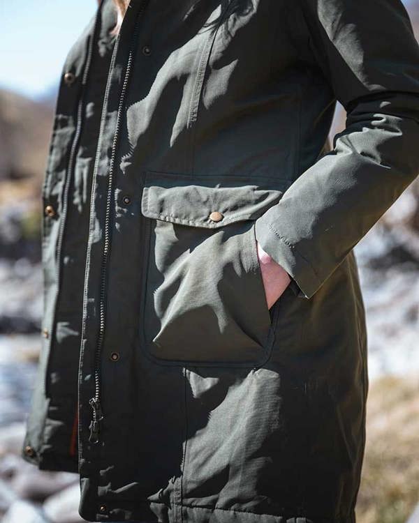 Women wearing the Hoggs of Fife walker long coat in Green