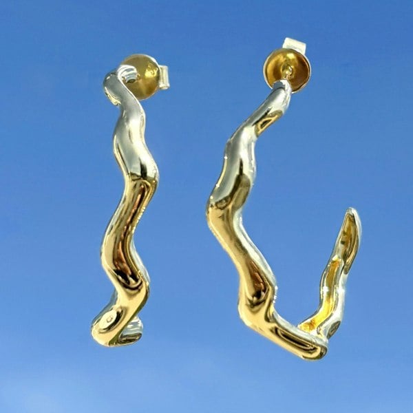 Wavy gold vermeil earrings by LENAE London, ocean-inspired fluid hoops.