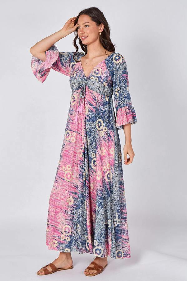 Woman wearing a colorful patterned dress on a white background