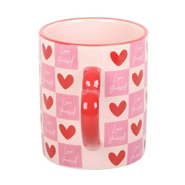 Pink checkered heart mug with red heart pattern and red insert on the inside