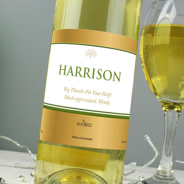 Close-up view of a custom gold label on a bottle of Personalised White Wine reading HARRISON.