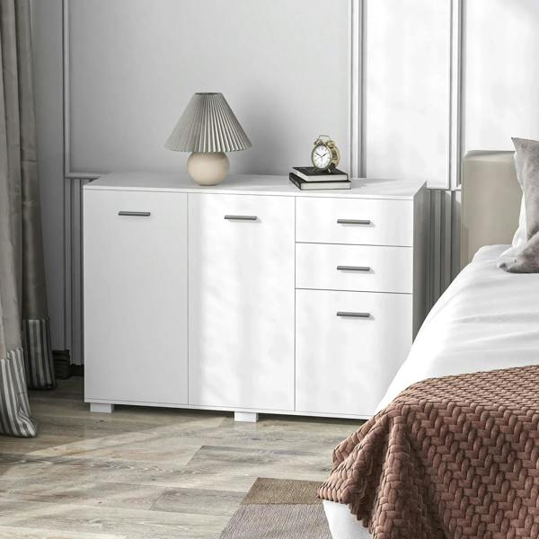 White multi-door sideboard with drawers and metal pulls in a bedroom setting