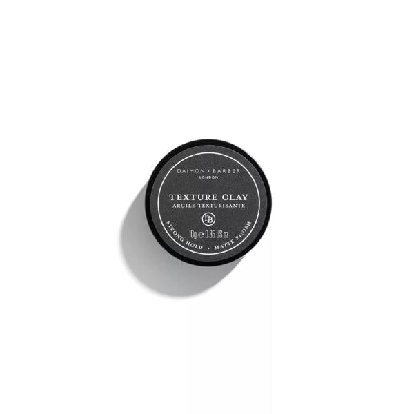 Over the top image of Daimon Barber Texture Clay 10g lid on a white background