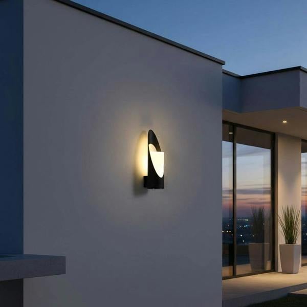 black outdoor wall light mounted on a white wall outside of a modern house