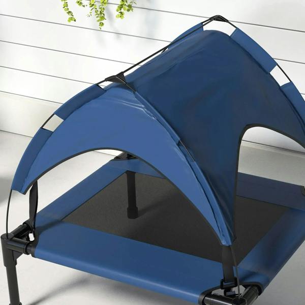 Close-up dark blue raised pet bed with canopy, front arch opening, and mesh panels