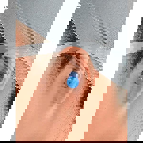 Blue silicone ear plugs with retaining cord and wireless earbud tip