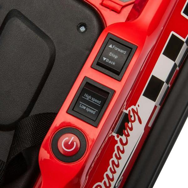 Red electric kids bumper car control panel with forward/back, speed, and power buttons.