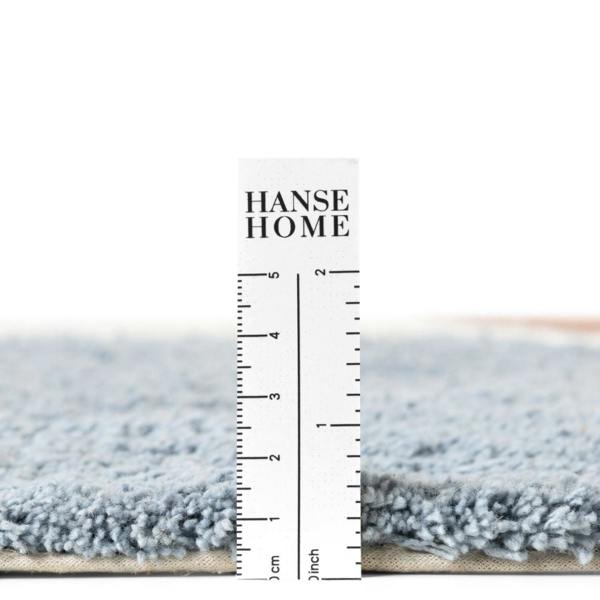 Gray rug with a ruler for scale and 'HANSE HOME' branding.
