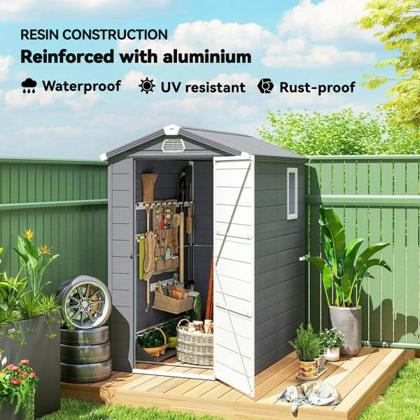 Grey plastic wall shed with roof vent, side window, and open front access