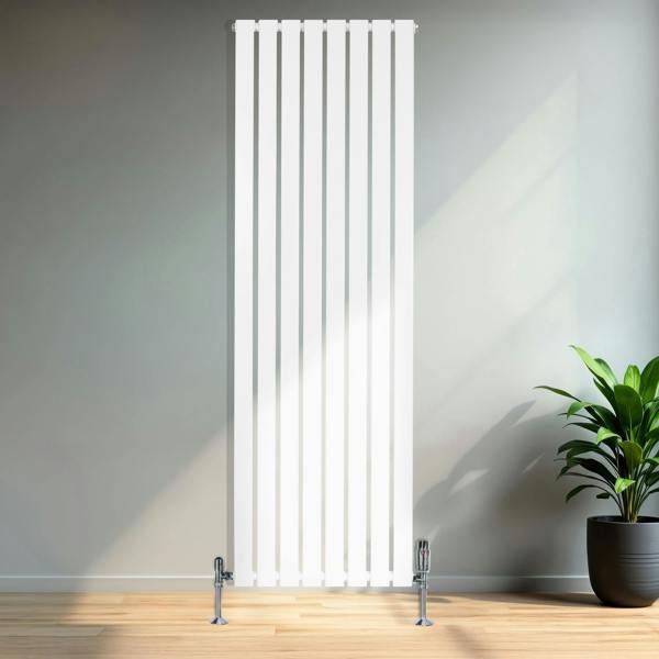 Tall white flat single column radiator with sleek vertical lines and chrome valves, set against a minimalist interior with a plant