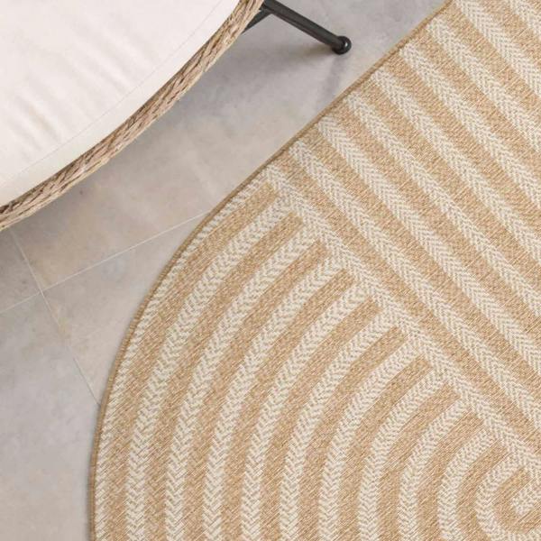 Beige woven rug with a geometric pattern on a tiled floor.
