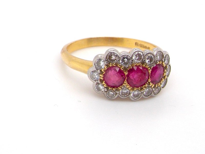 Vintage Tom An 18 carat gold triple cluster ruby and diamond ring