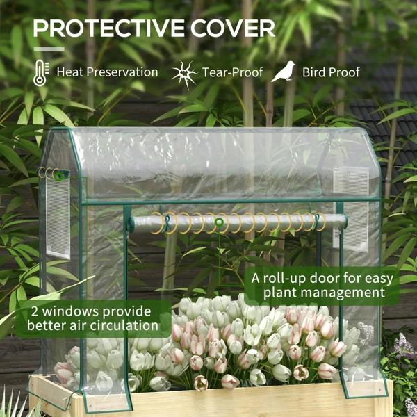 Clear greenhouse cover on raised planter box with roll-up door and side windows