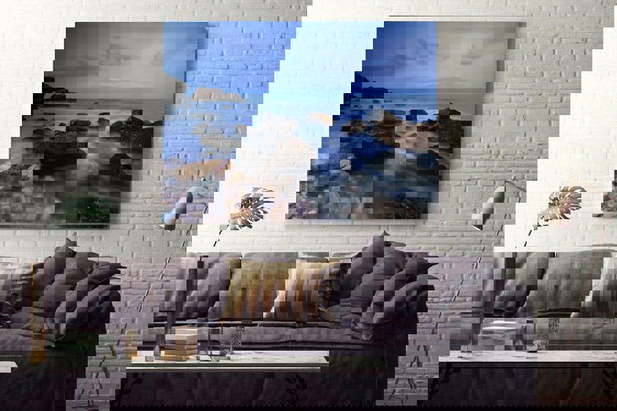 blue coastal seascape art print with rocky shoreline