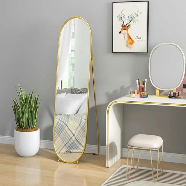 Gold-tone two-way oval full-length mirror with arched frame on folding base.