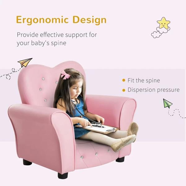 Pink toddler armchair with heart backrest; child writing while seated