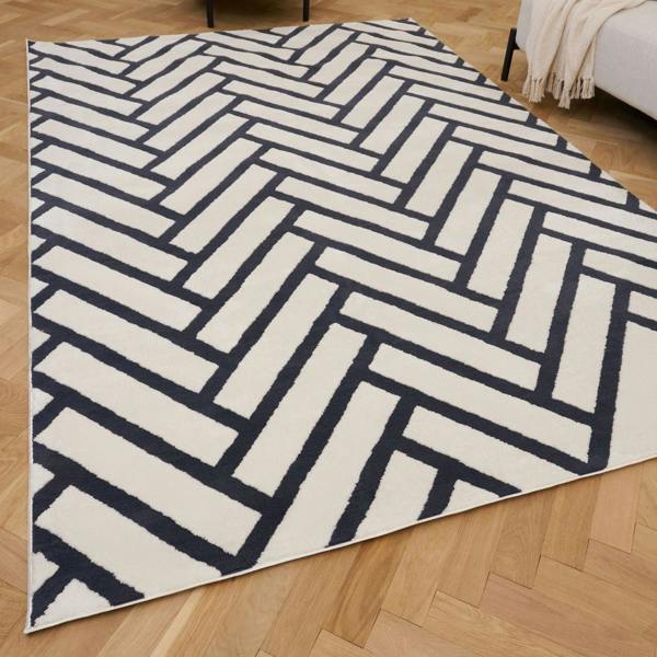 Geometric patterned rug on a wooden floor