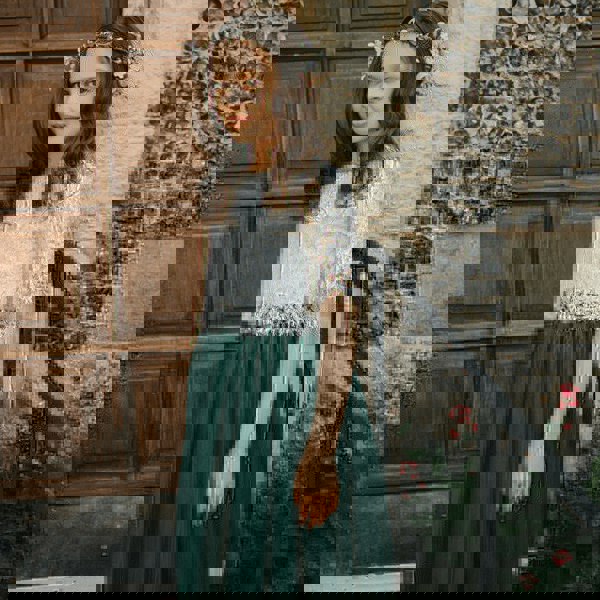 bridesmaid wearing hunter green skirt and lace top