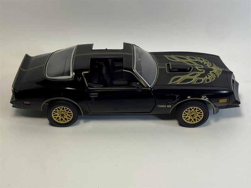 a black toy car with wings