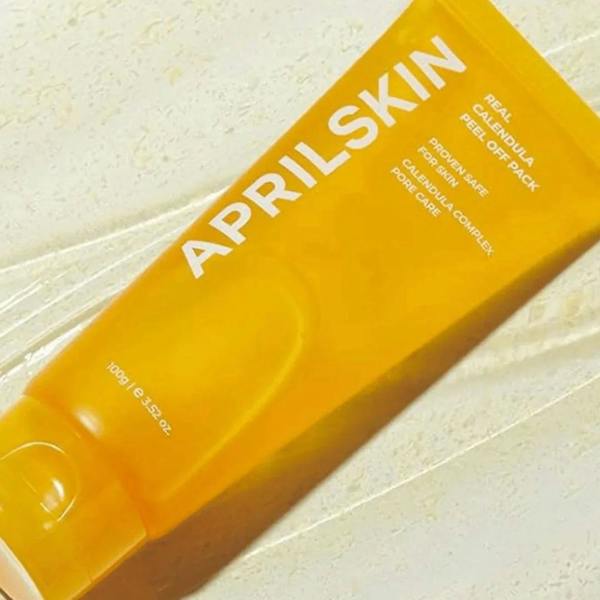 Clear gel texture with visible flower petals in APRILSKIN Calendula Mask – Gentle peel-off formula for a smooth "Glass Skin" texture at Atelier De Glow UK.