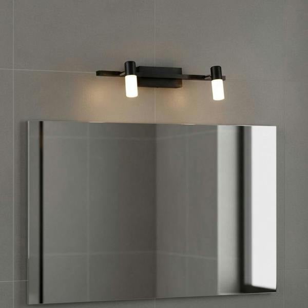 black wall light for bathroom mirror mounted over a mirror in a modern bathroom