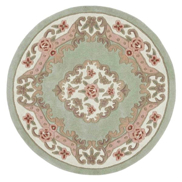 Round decorative rug with floral patterns on a light green background