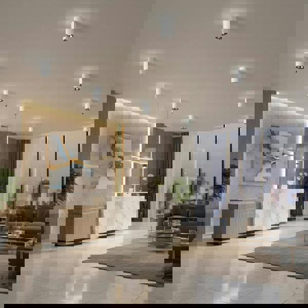 white round surface mounted downlight shown on the ceiling in a hotel reception area