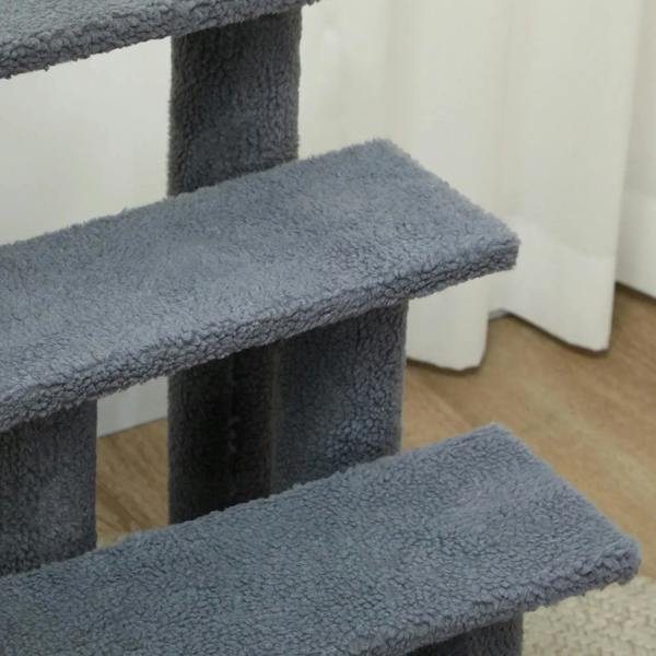Close-up of grey plush pet stairs steps with textured tread and side supports