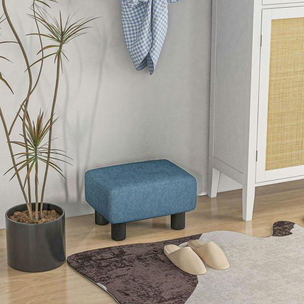 Blue linen cube ottoman footstool with black legs in a corner setting