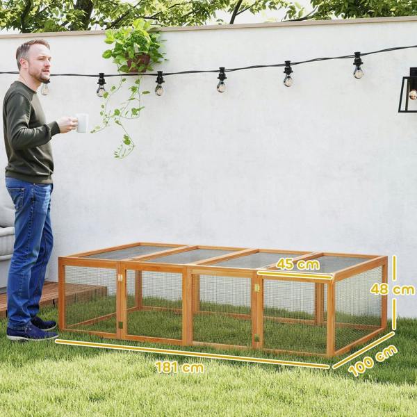 Wooden rabbit hutch with wire mesh walls and open top run, viewed full length