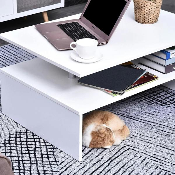 White coffee table with open shelf and countertop items, aluminum legs