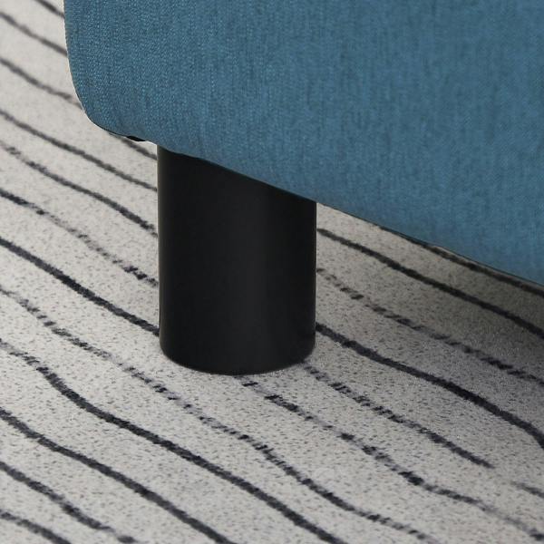 Black plastic leg of a blue linen cube ottoman footstool
