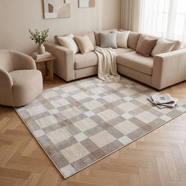 Living room with a beige sectional sofa, checkered rug, and armchair.