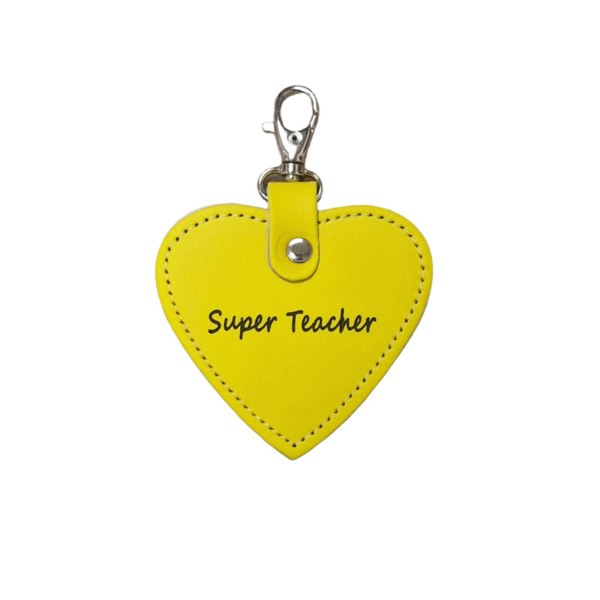 Yellow heart-shaped keychain with 'Super Teacher' text on a beige background