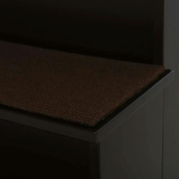Close-up of brown carpet-covered step on dark brown pet stairs