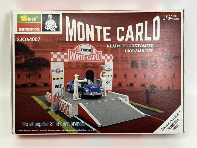 a box with a toy car and a man standing on it