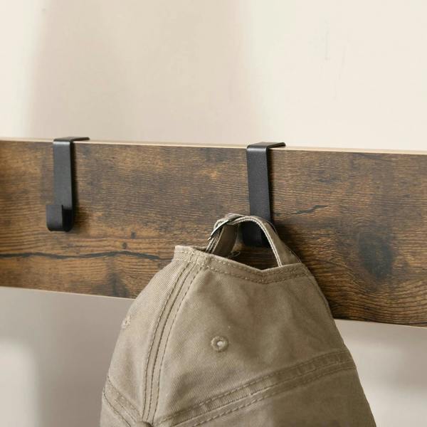 Rustic wood backboard with black removable coat hook holding a beige fabric bag