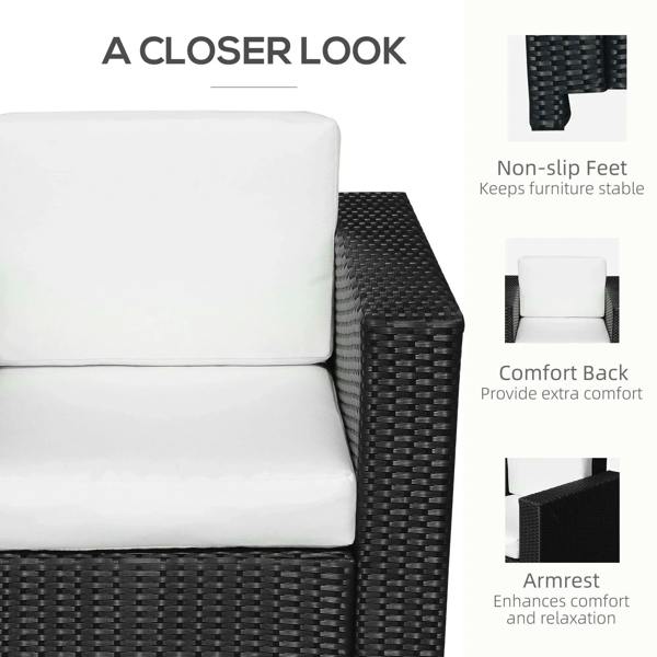 Black rattan armchair with padded backrest, white cushion, and wide armrests