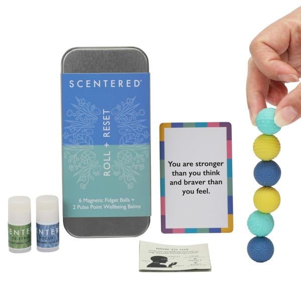 Scentered Roll + Reset kit with magnetic roller balls, de-stress mini balm, focus mini balm, and motivational card on a white background.