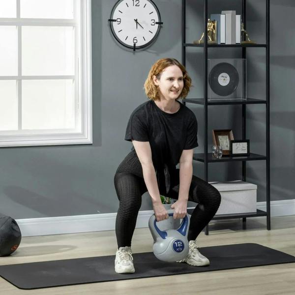 12 kg kettlebell with blue handle being held during a home workout squat