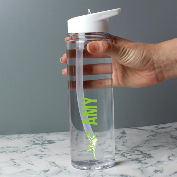 A hand holding a clear 750ml sports water bottle custom-printed with the name 'Amy' in lime green vertical font above a female tennis player graphic.