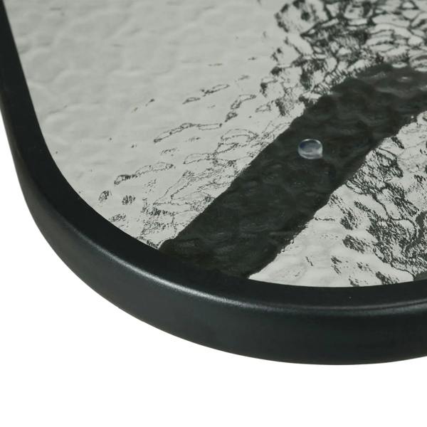 Square tempered-glass tabletop edge with black frame, showing umbrella hole area