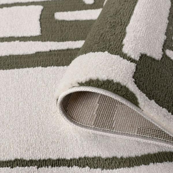 Close-up of a textured rug with geometric pattern