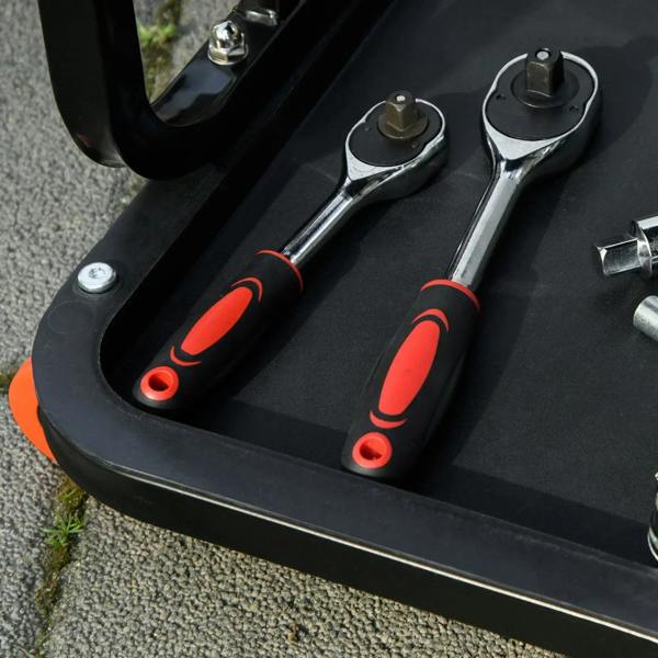 Black tool tray with molded slots and chrome spanner wrenches on rolling stool
