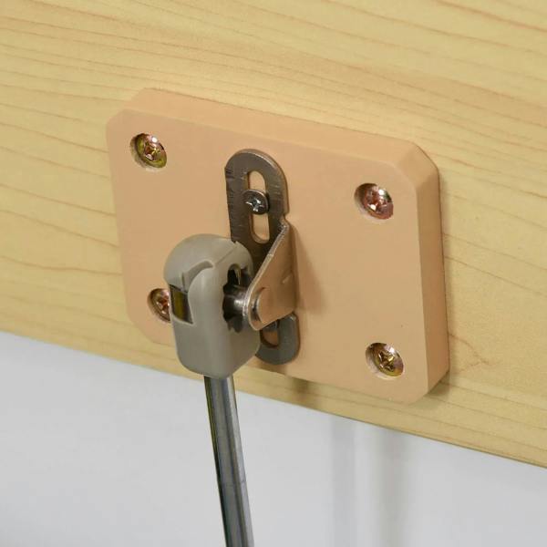Safety pneumatic rod and metal hinge on light wood lid of toy box