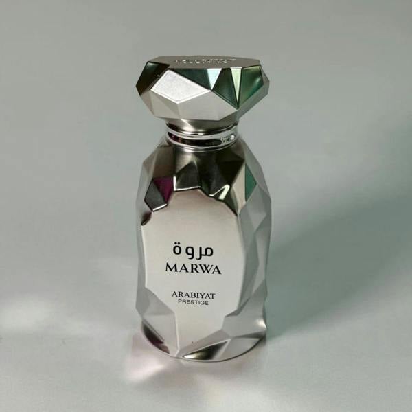 Arabiyat Prestige Marwa Eau de Parfum 100ml for Men bottle on wooden table indoors