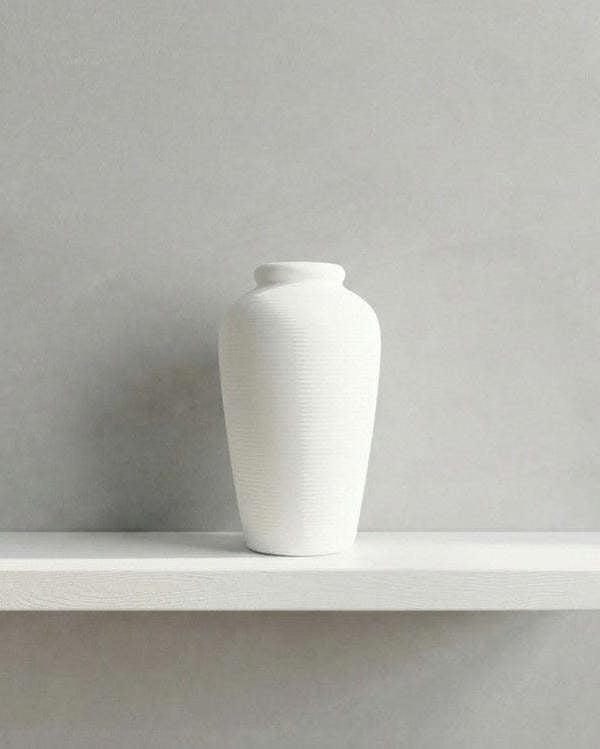 White vase on a shelf 