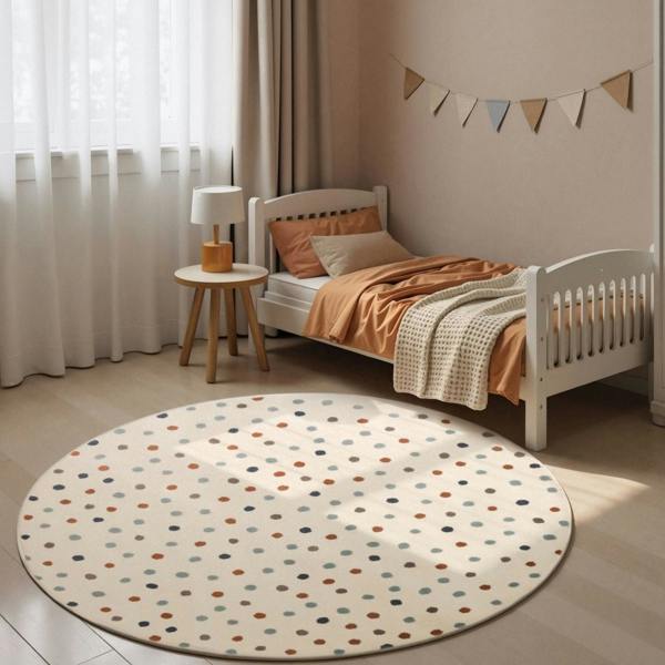 Children's bedroom with a polka dot rug, bed, and small table.