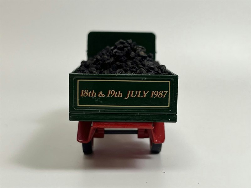a toy truck with rocks in it