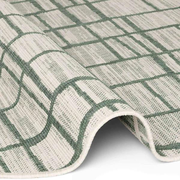 Close-up of a green and beige checkered rug on a white background